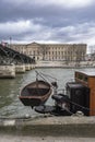 The Seine in Paris with the Louvre and a boat